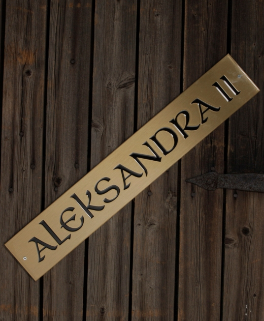 THE NAME TAG OF THE ALEKSANDRA ROWING BOAT